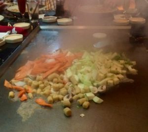 Sizzling vegetables on the yep-an grill