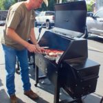 Checking ribs on Sawtooth Grill's smoker