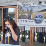 Checking the beer at Grand Teton Brewing's booth