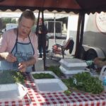 Garnishing a competition box at Swine Stewards BBQ