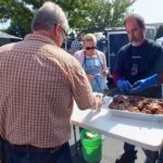 Getting a BBQ sample from Swine Stewards BBQ Team