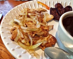 Grilled pork chop with delicious onions rice and beans