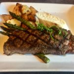 New York Steak and roasted potatoes plate