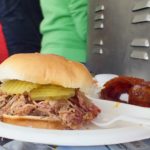 Pulled pork sandwich with pig candy from Spud's BBQ and Catering