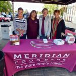 Taking care of the donation table for the Meridian Food Bank donations