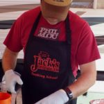 Trimming brisket from Phil and Lou's BBQ Team