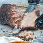 Slicing the brisket for judging