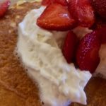 Strawberries on pancakes closeup