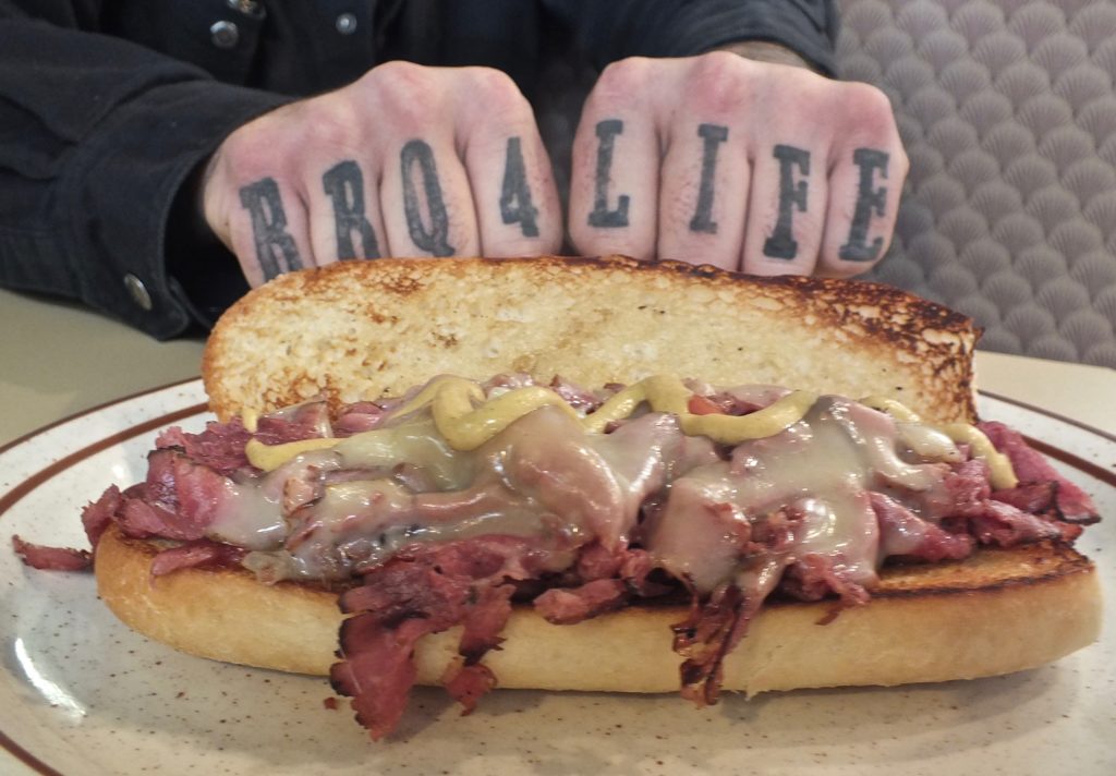 Brad's tattoo and pastrami sandwich at BBQ4Life in Boise