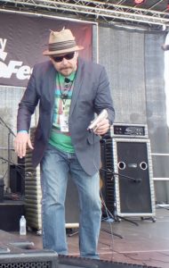 John Nemeth standing on stage