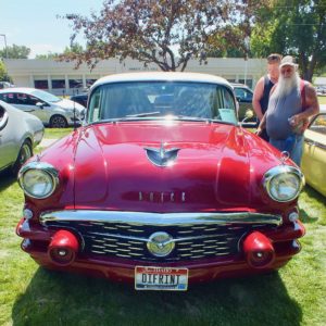 Checking out a Buick at the emmett Show and Shine Car Show