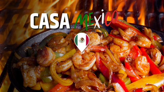 Sizzling fajitas with shrimp and peppers over a hot flame for Casa Mexico in Boise, Idaho.