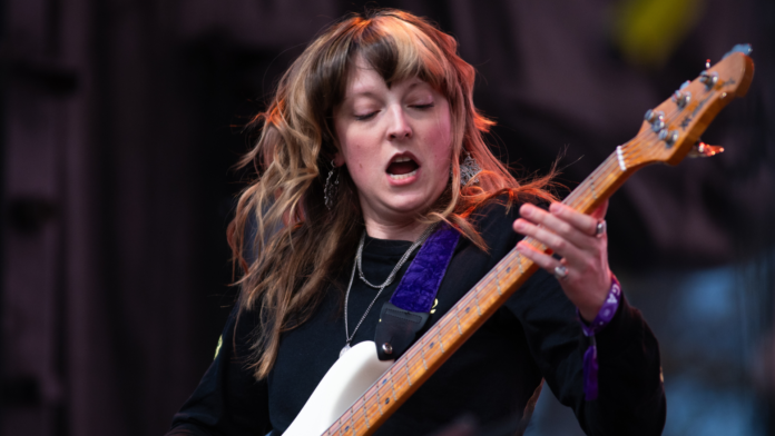 Melanie Radford rocking the bass at a concert.