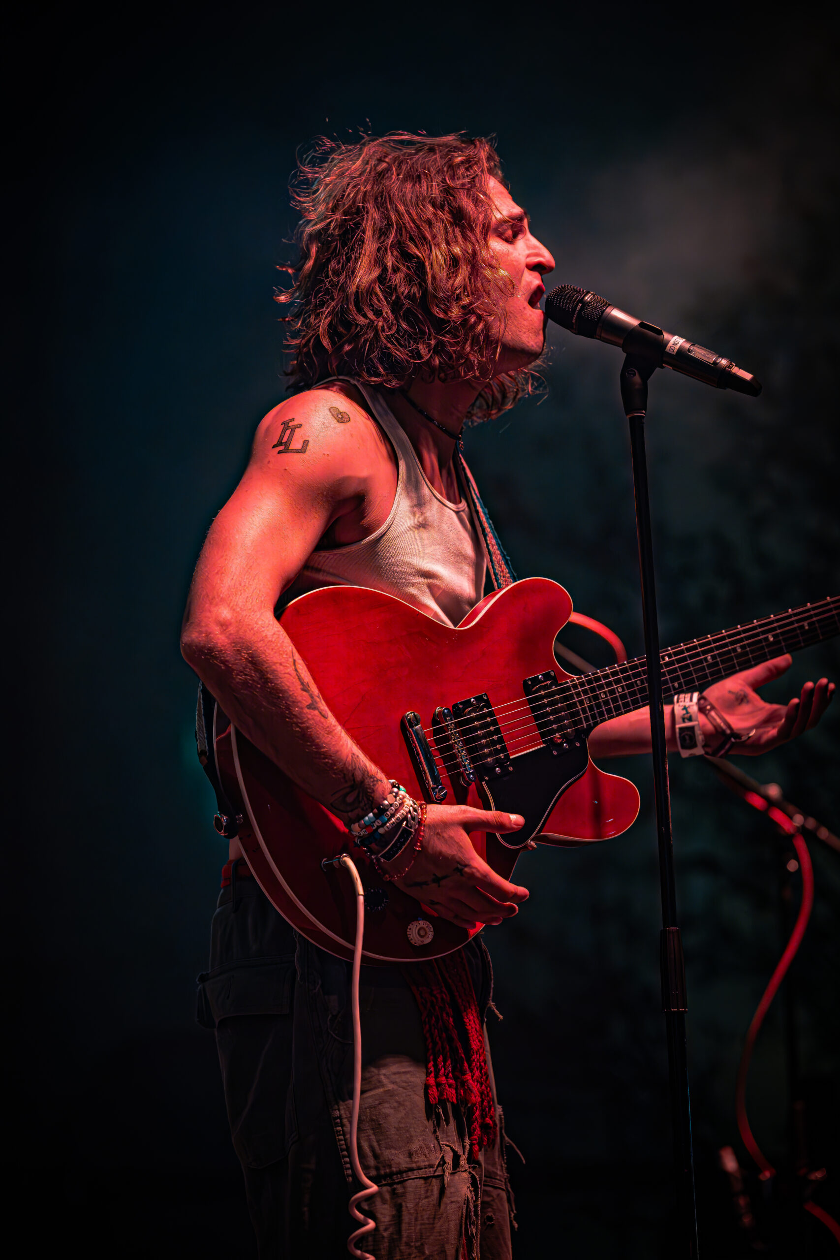 A passionate musician lost in the moment during a live performance.