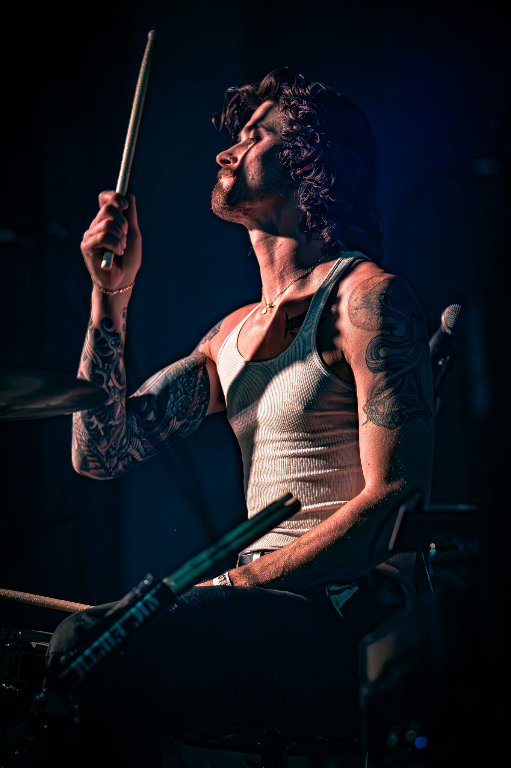 Drummer in a moment of passion during a live performance.