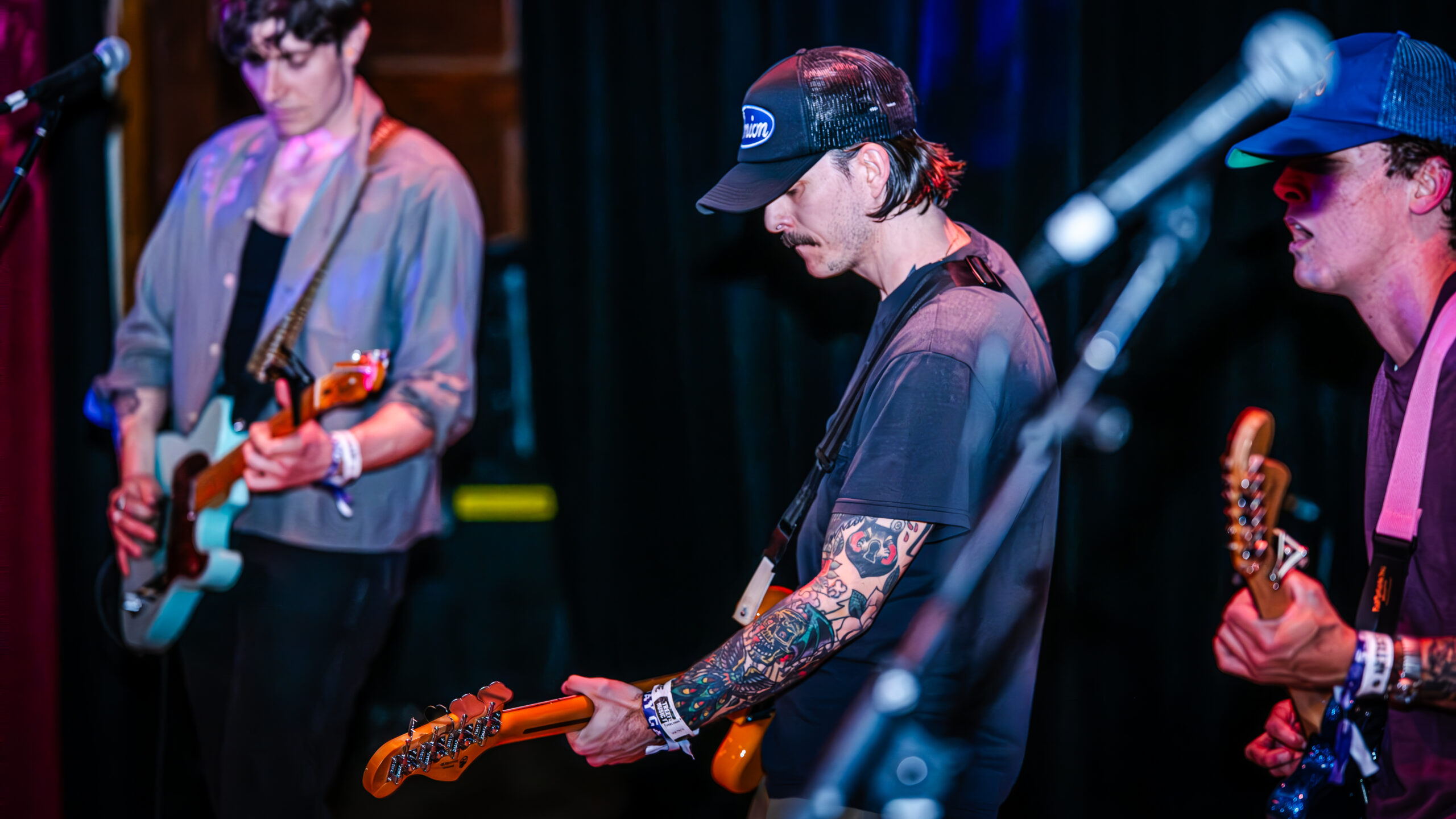 Guitarist in intense performance.