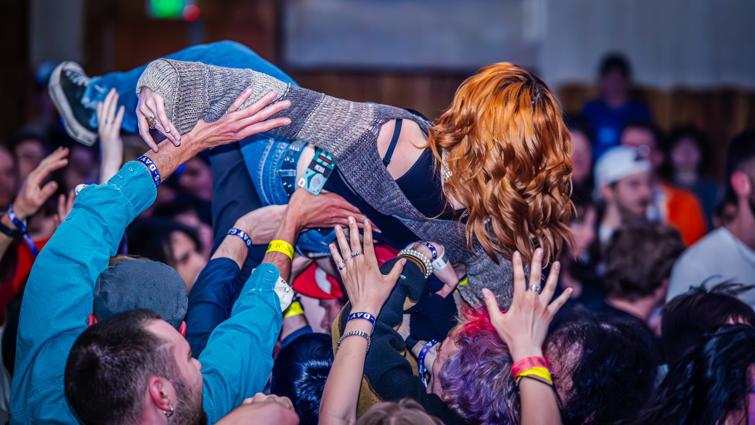 Audience member crowd surfing.