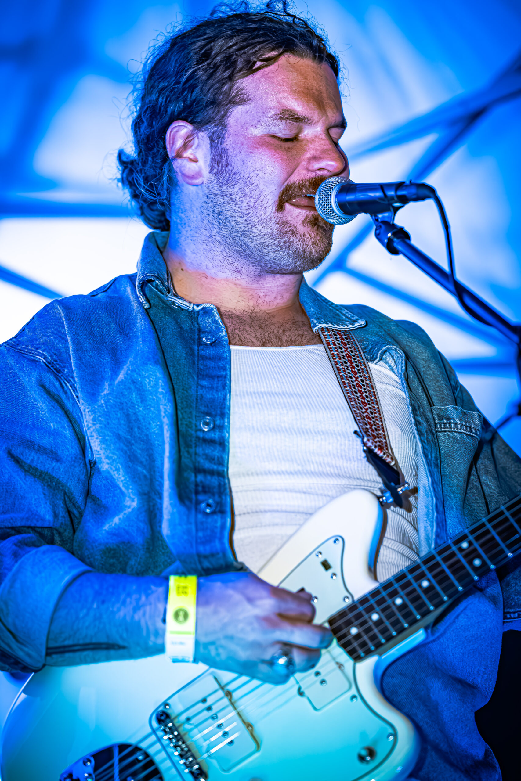 Lead vocalist Brady Stablein of Brother Elsey singing into a microphone.