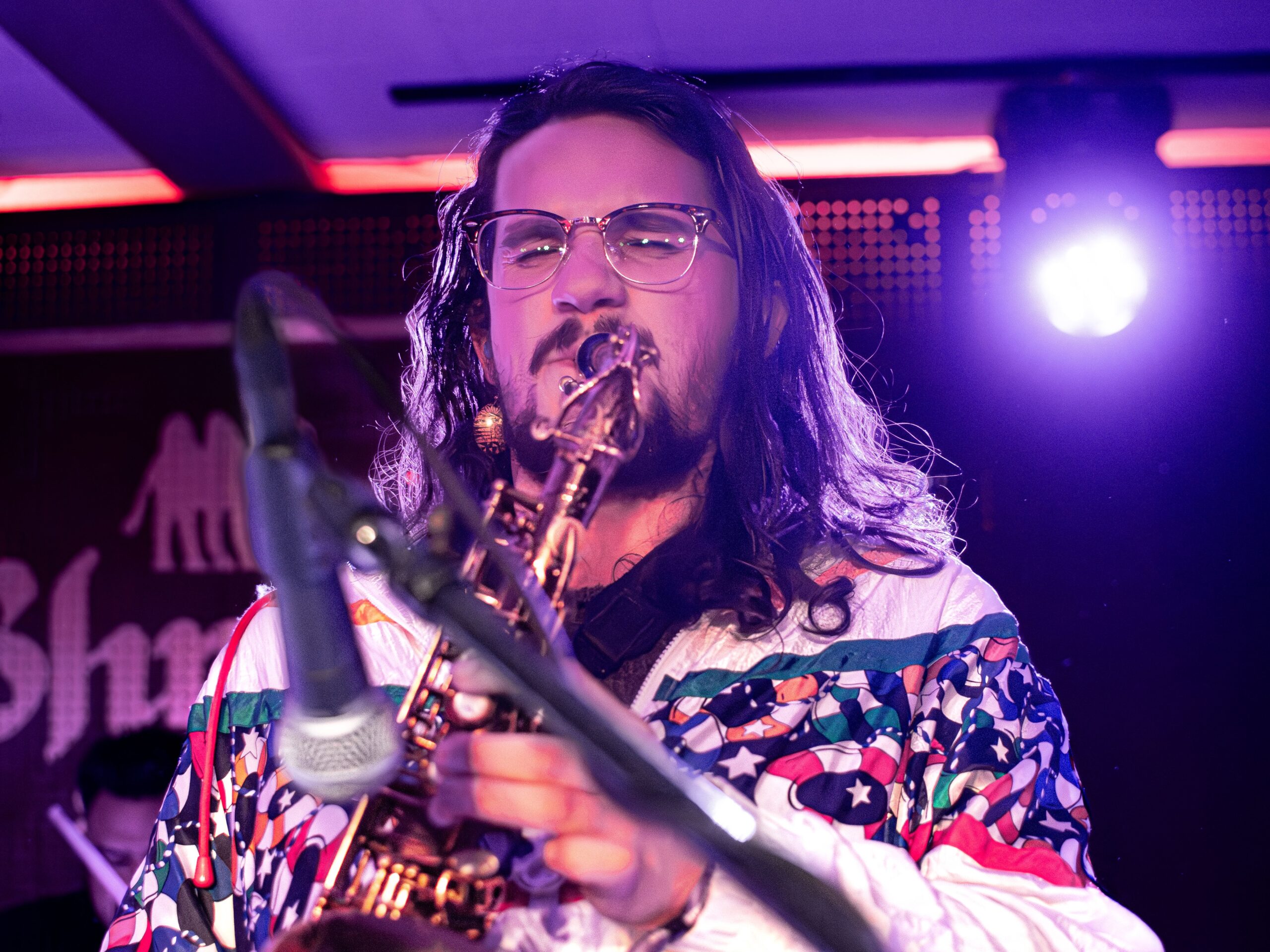 Olivia Vika band member playing saxophone on stage at the 2024 Treefort Music Festival.