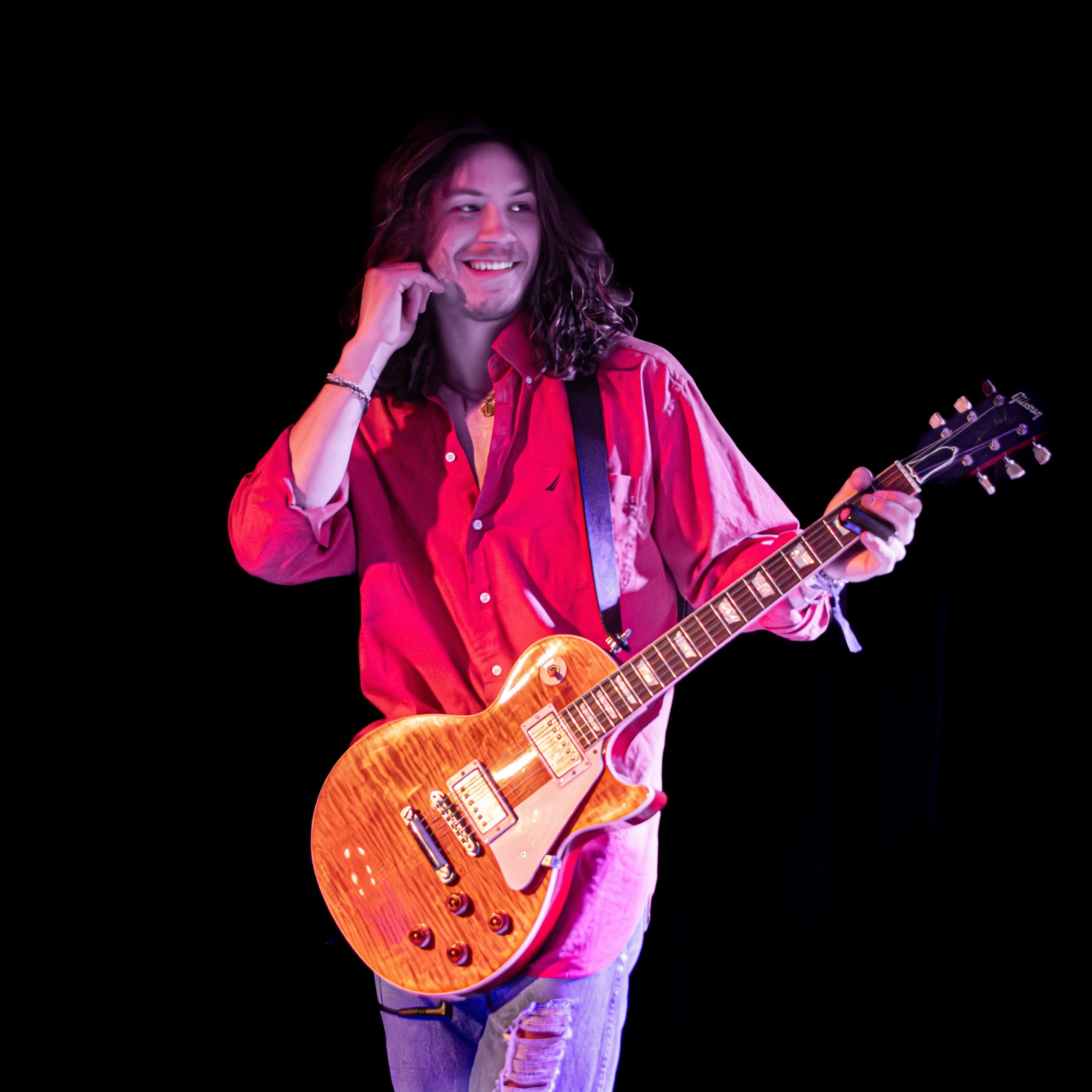 Olivia Vika band member playing guitar on stage at the 2024 Treefort Music Festival.