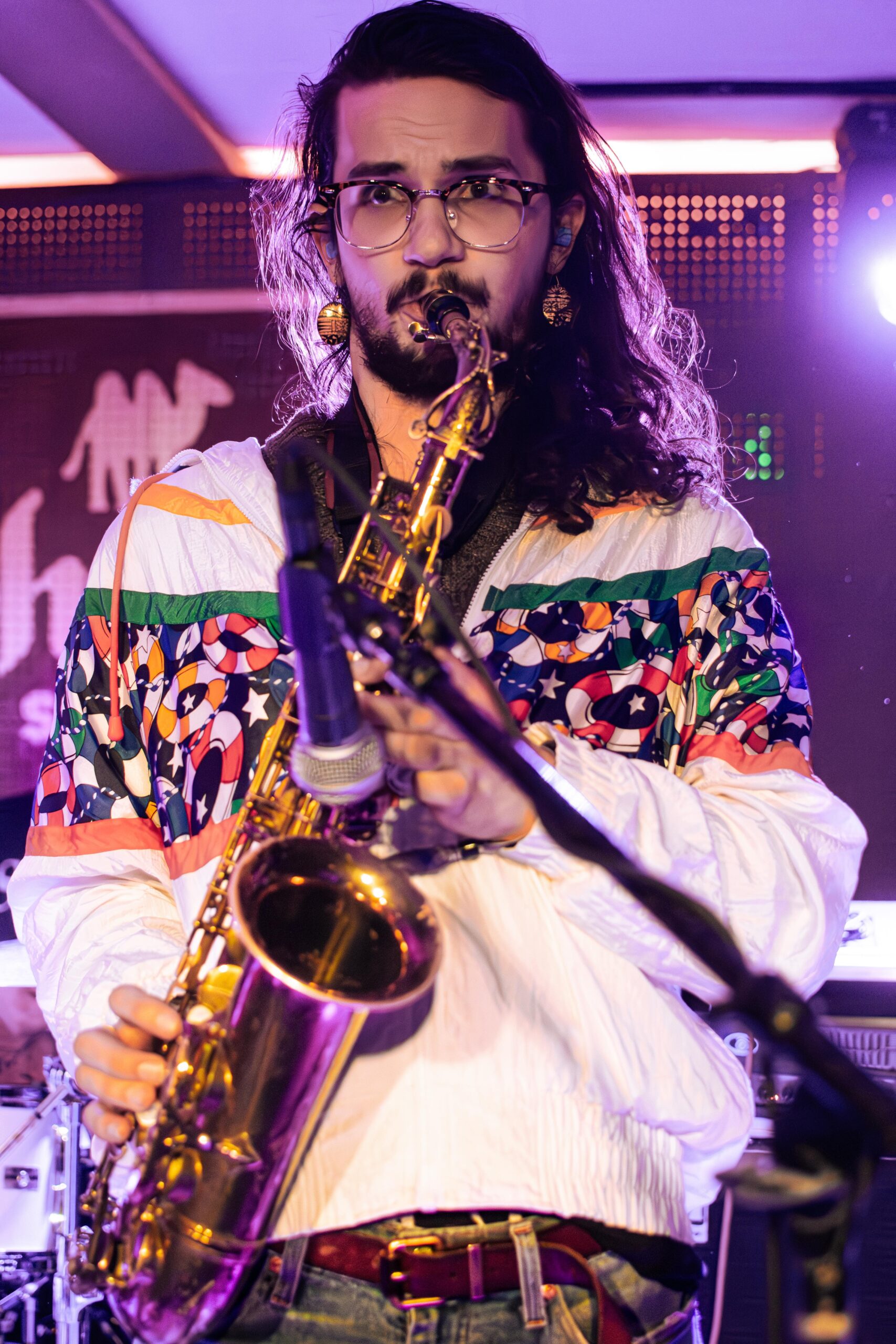 Olivia Vika band member playing saxophone on stage at the 2024 Treefort Music Festival.