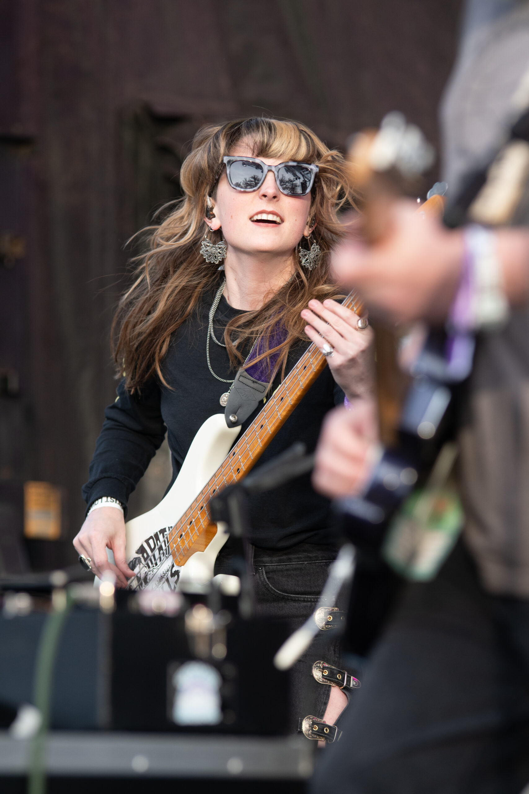 Melanie Radford rocking the bass at a concert.