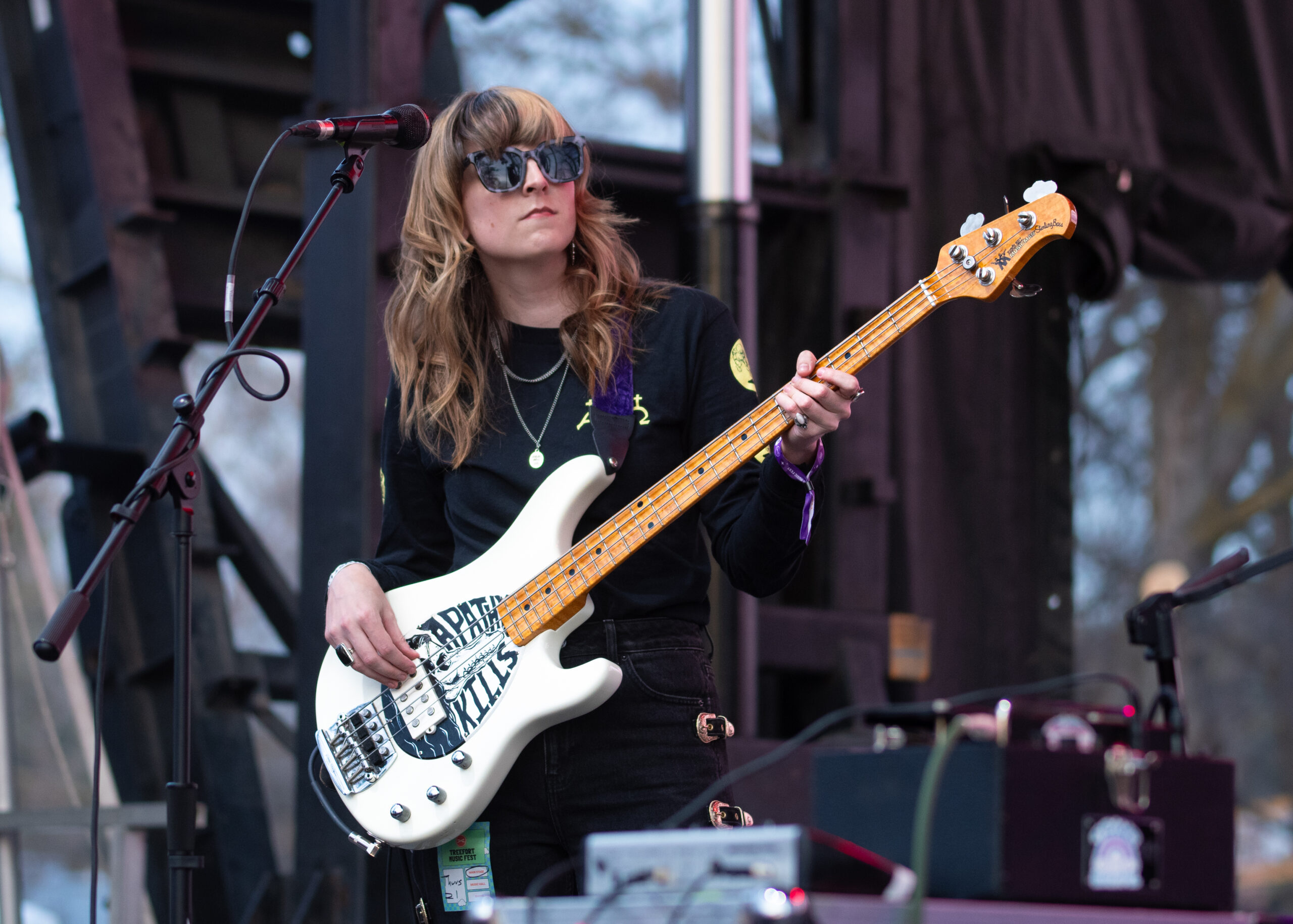 Melanie Radford rocking the bass at a concert.