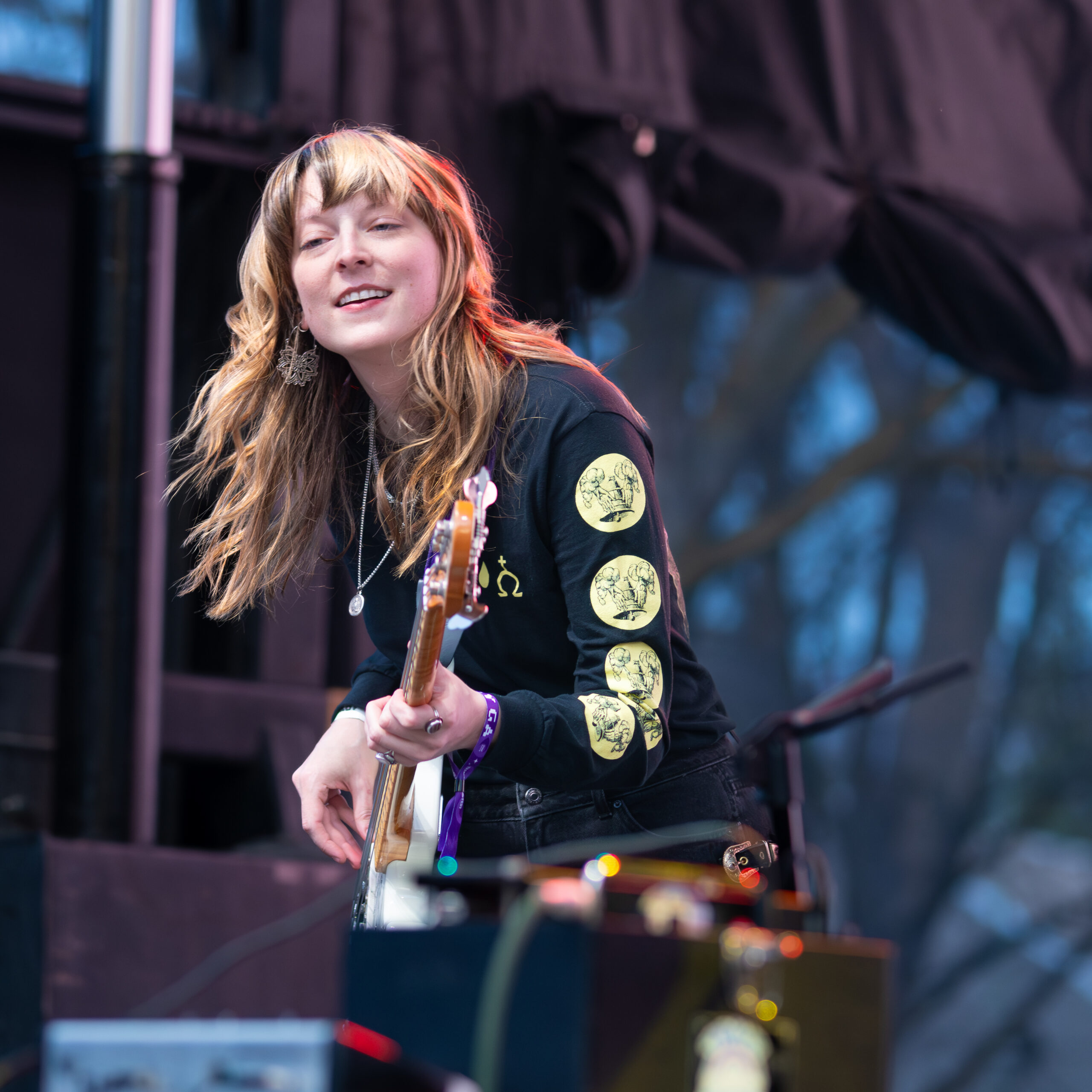 Melanie Radford rocking the bass at a concert.