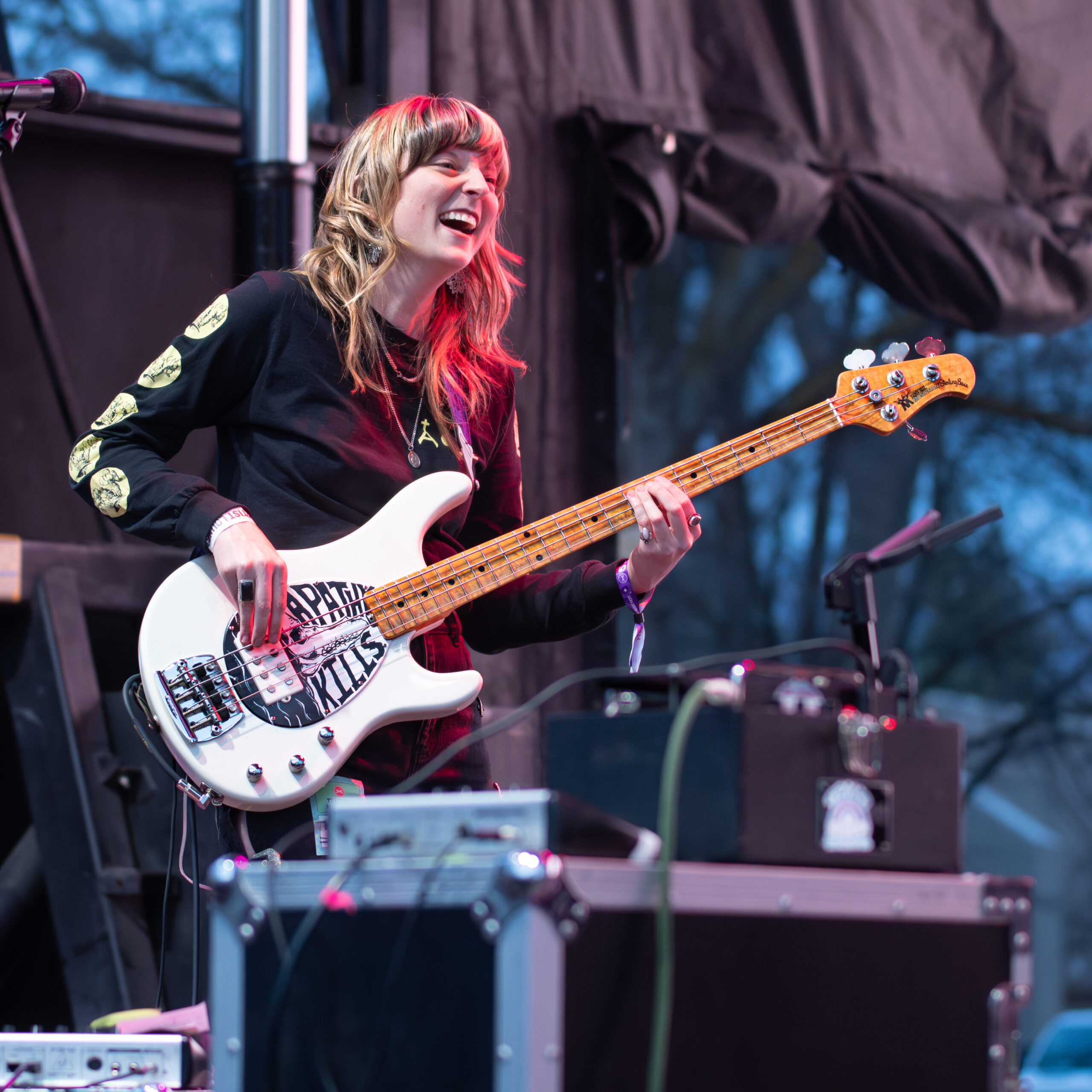 Melanie Radford rocking the bass at a concert.