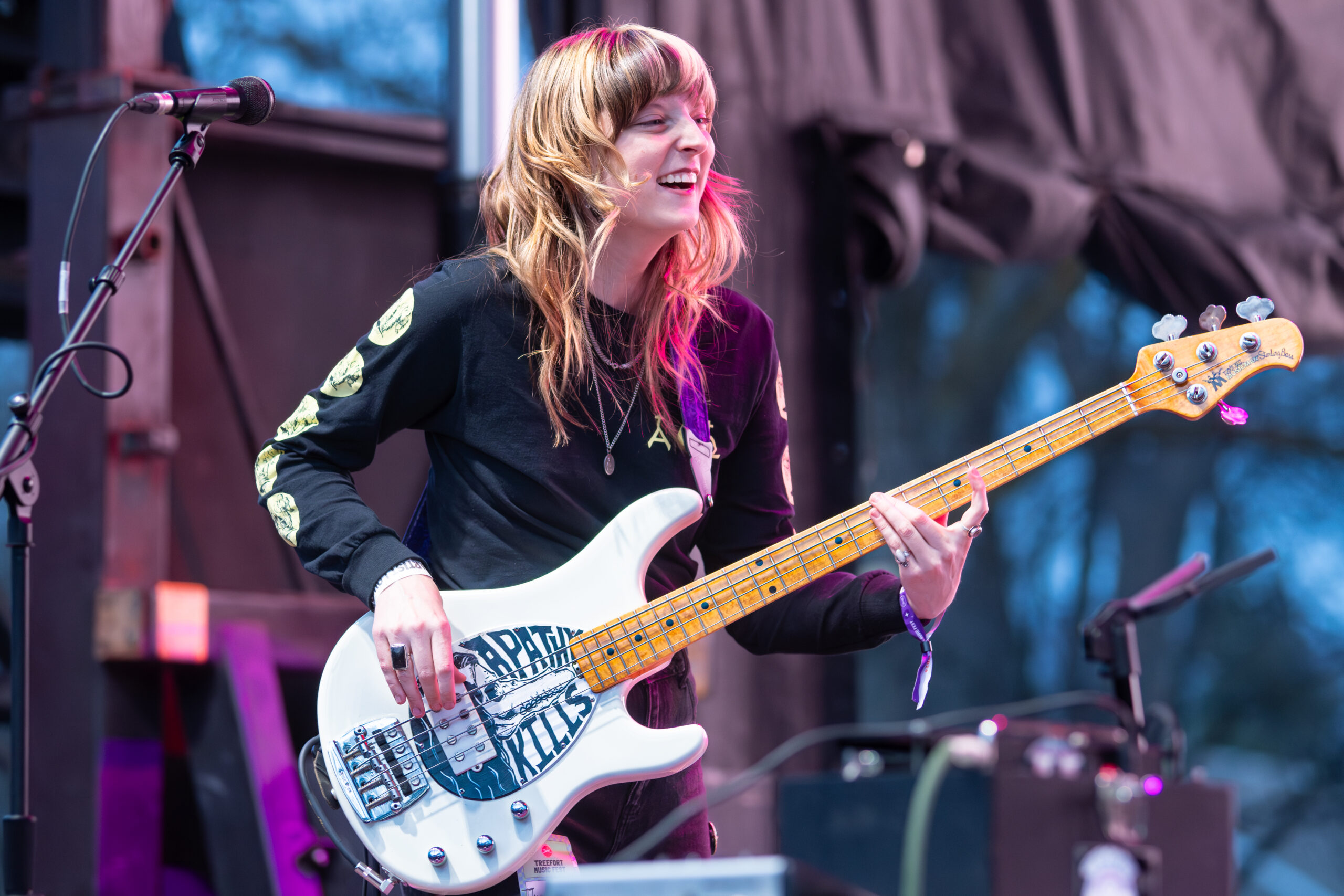 Melanie Radford rocking the bass at a concert.