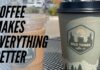 Two Wild Things Coffee cups, one iced and one hot, sitting on an outdoor table with the text "Coffee Makes Everything Better" overlaid on the image.