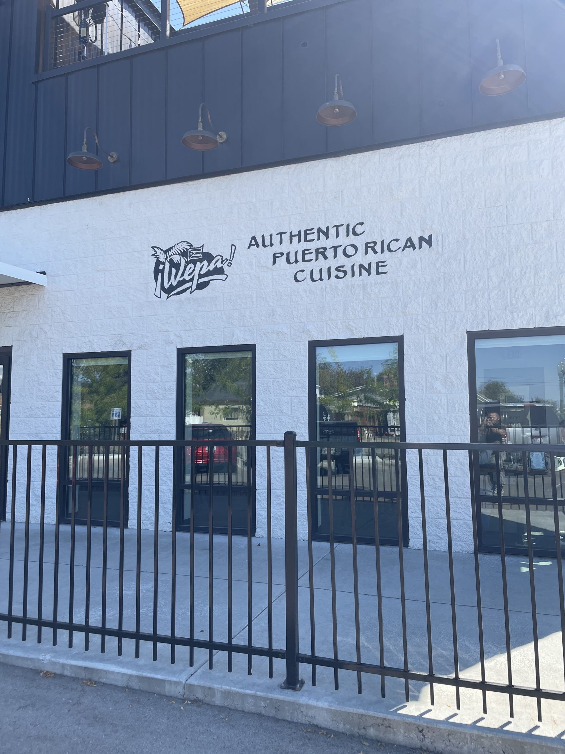 Exterior of Wepa Café featuring "Authentic Puerto Rican Cuisine" signage.