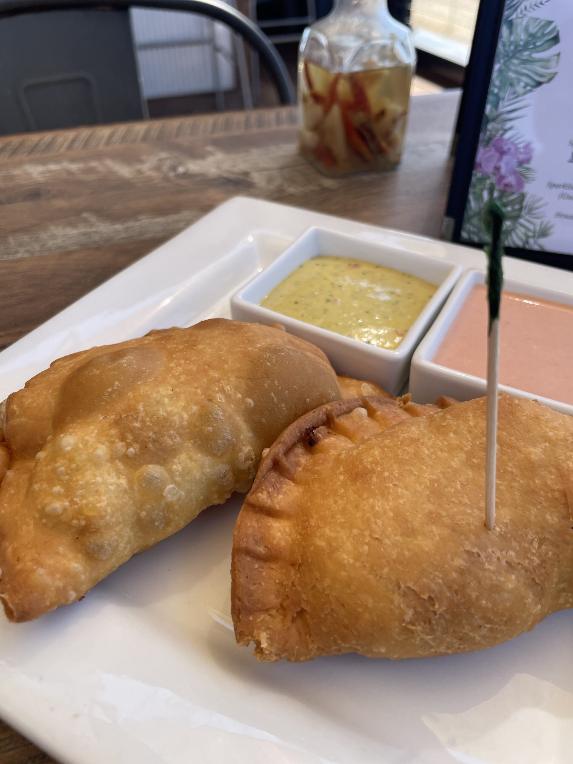 Pastelillos served with dipping sauces at Wepa Café.