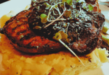 Corso Italian Steakhouse Review: Why This Italian Steak Gem Is Boise’s Best Anniversary Dinner Spot Snake River Farms porkchop served at Corso Italian Steakhouse in Boise, Idaho; topped with bourbon bacon jus and microgreens over creamy mashed potatoes.