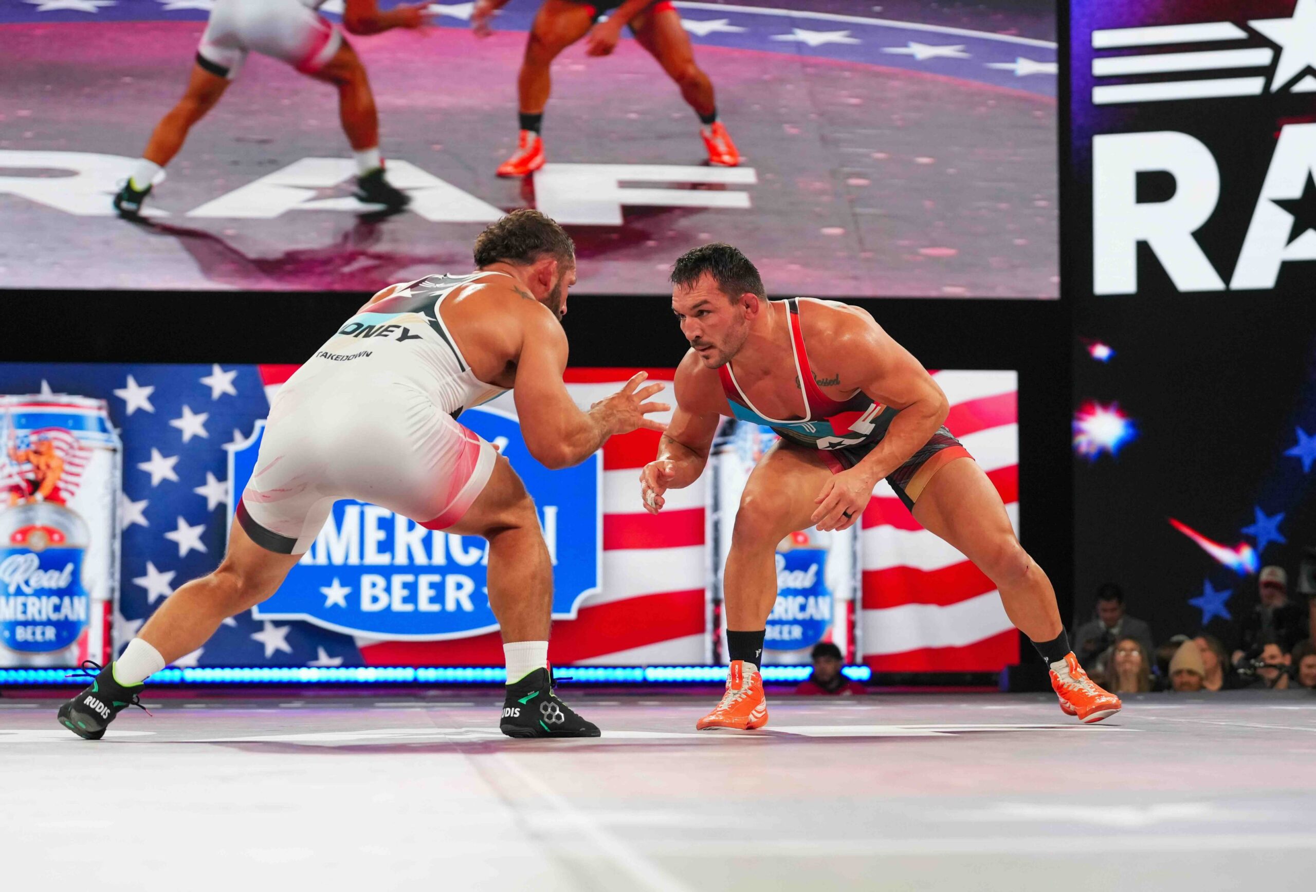 Michael Chandler and Chad Mendes face off in a wrestling stance during their RAF 03 main event match in Chicago, competing under Real American Freestyle rules.