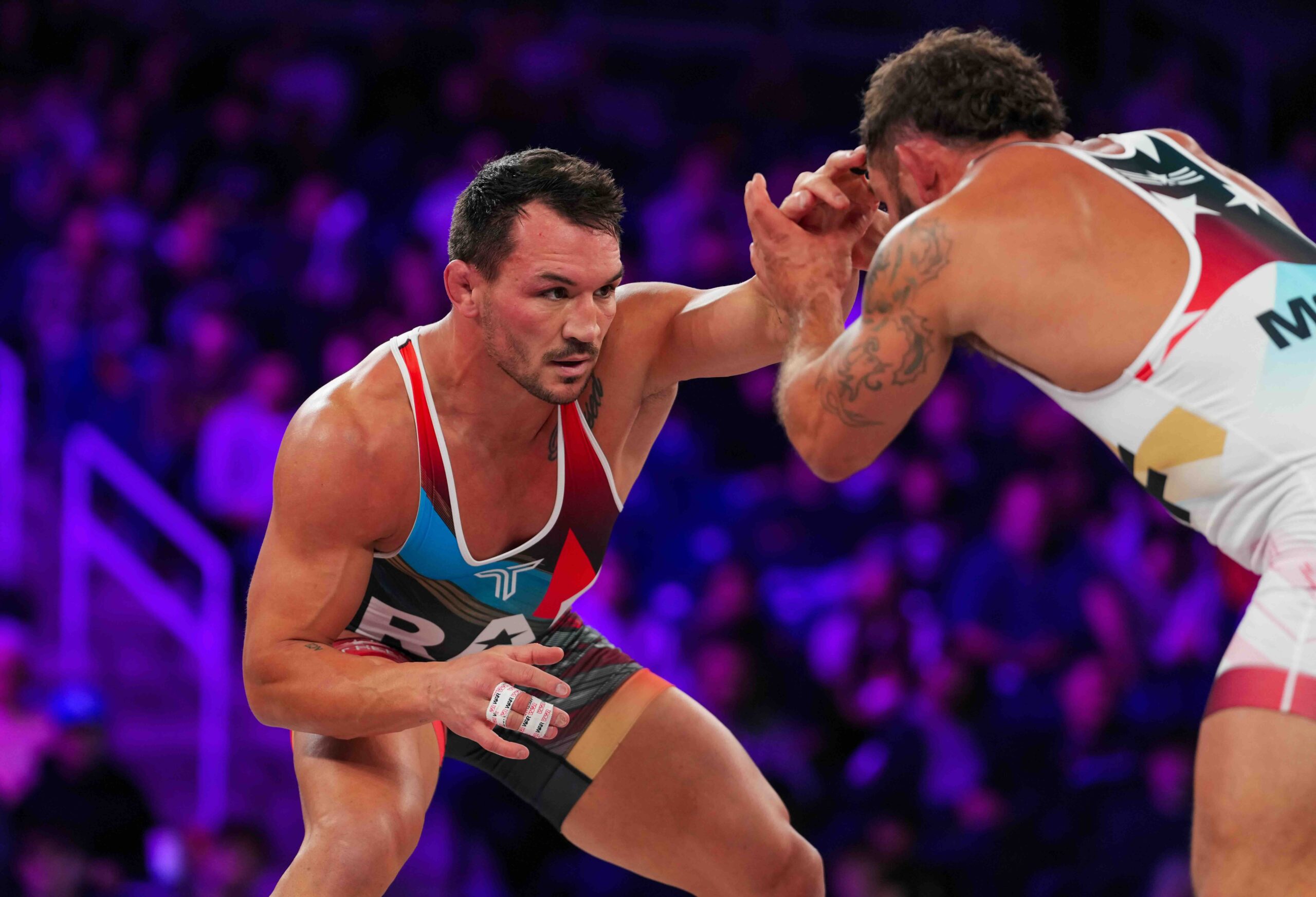 Michael Chandler and Chad Mendes square off in the Chandler vs Mendes 175 lb main event at RAF 03, showcasing high-level hand-fighting and stance work.
