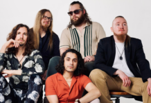 From Craigslist Beginnings to a Soul-Folk Breakthrough: Orlando Peña of The Midnight Purchase The Midnight Purchase band portrait featuring Orlando Peña and members seated in a studio setting, showcasing the Milwaukee-based soul-folk and Americana group.