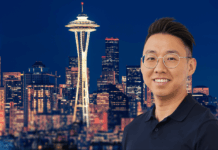 Dat Tran on Stress, Resilience & Becoming Unstoppable Under Pressure Dat Tran, stress resiliency coach and keynote speaker, smiling in front of the Seattle skyline with the Space Needle at night.