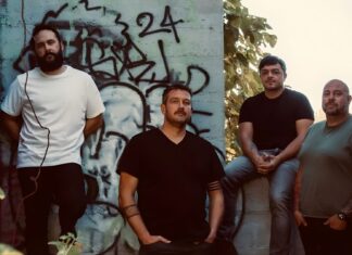 Mylo Bybee indie rock band members posing against graffiti wall in Boise Idaho promotional photo for Revisions EP