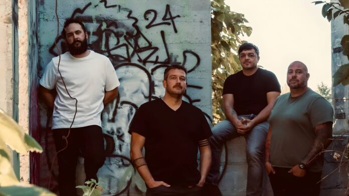 Mylo Bybee indie rock band members posing against graffiti wall in Boise Idaho promotional photo for Revisions EP