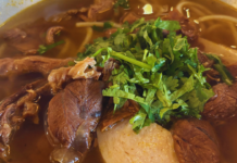 Pho 7 & Baguette Review: Where Meridian Finds Its Pho Fix (and Then Some) Steaming bowl of Vietnamese pho with tender beef slices, rice noodles, fresh cilantro, and rich broth at Pho 7 & Baguette in Meridian, Idaho