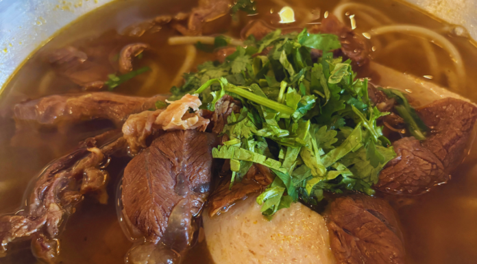 Pho 7 & Baguette Review: Where Meridian Finds Its Pho Fix (and Then Some) Steaming bowl of Vietnamese pho with tender beef slices, rice noodles, fresh cilantro, and rich broth at Pho 7 & Baguette in Meridian, Idaho