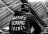 Fights on Fremont 5: Storm Pawson on Boxing, Mentorship, and Building Something Bigger Than Fight Night Storm Pawson of Fighter’s Chance Boxing Gym sits ringside in a black-and-white image ahead of Fights on Fremont 5, a USA Boxing-sanctioned outdoor boxing event in Rupert, Idaho.